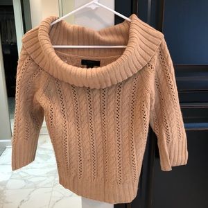 Cowl neck cable knit sweater.